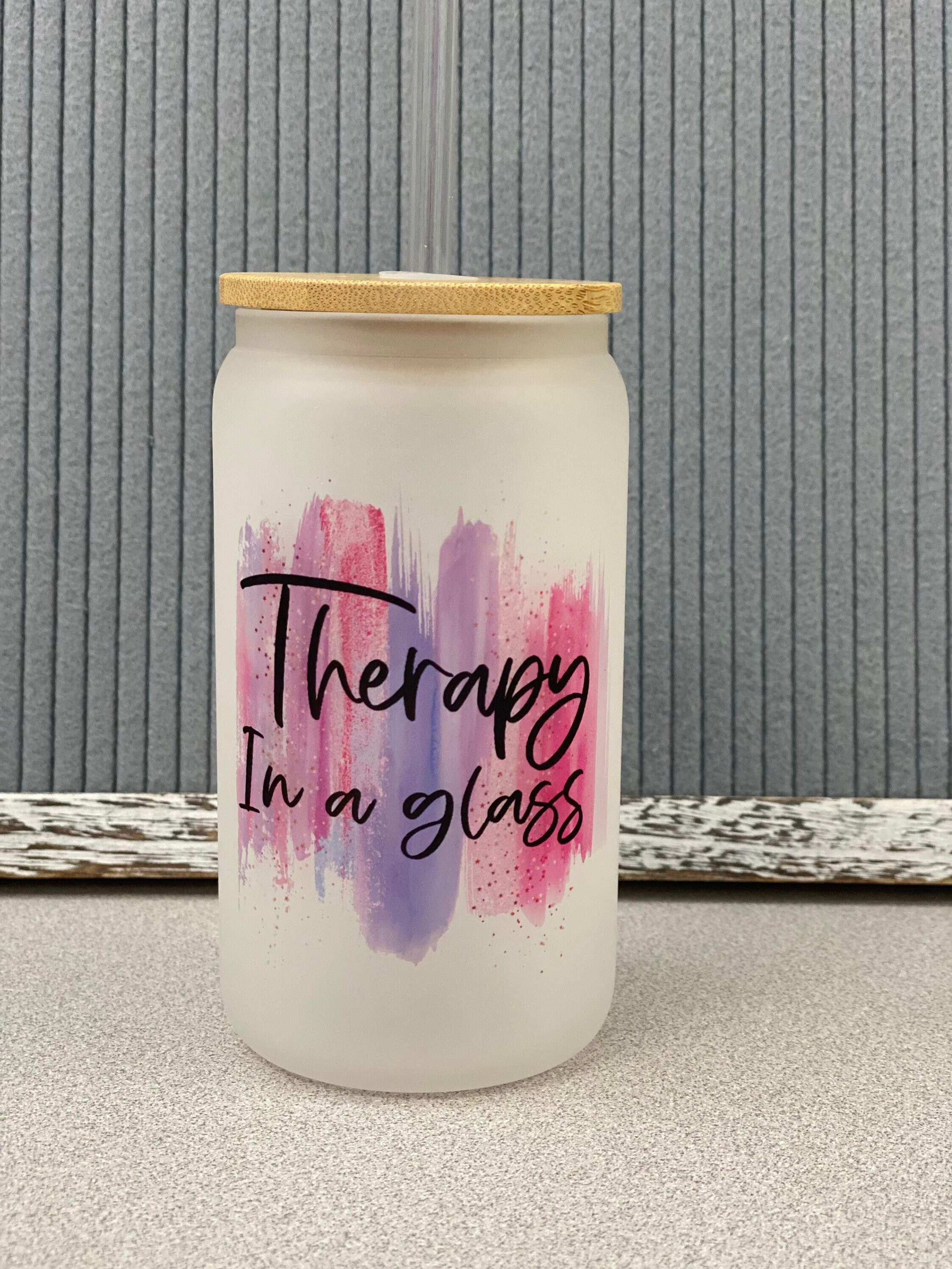 Therapy in a glass- frosted can shaped glass with lid and straw